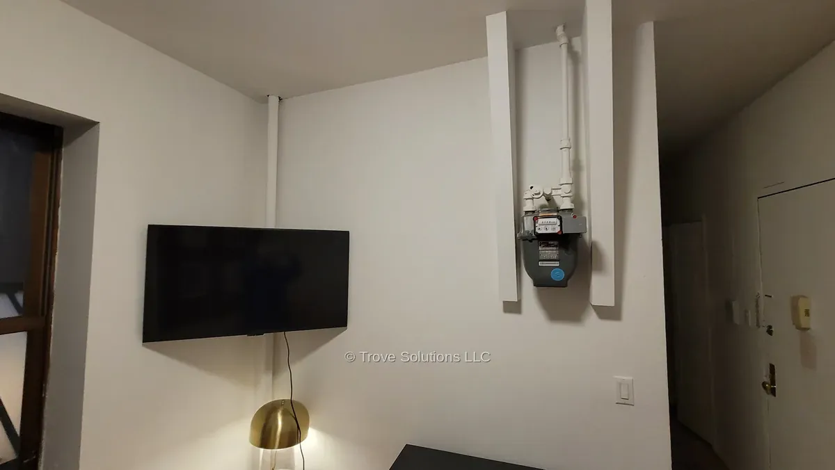 Corner TV installation Manhattan apartment with gas meter nearby