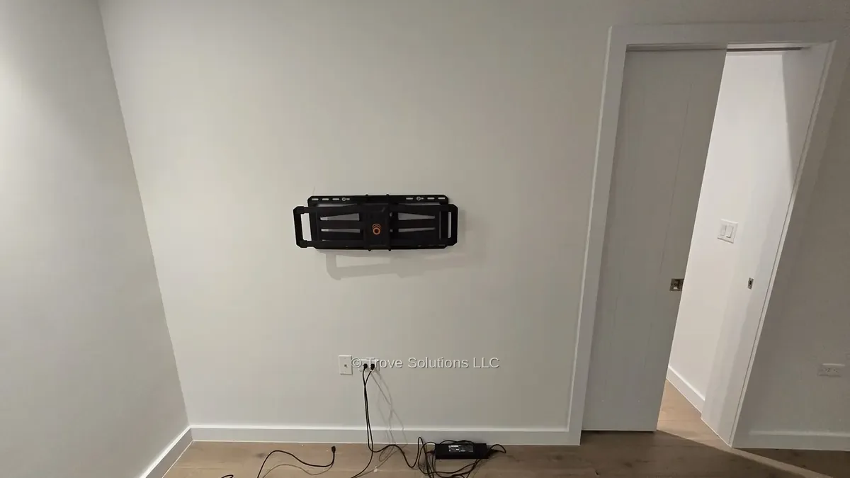 TV wall mount installation next to pocket door Manhattan