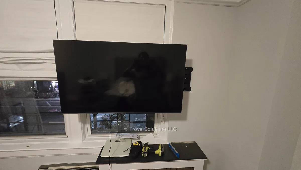 Full motion TV mount pulled out over window Manhattan