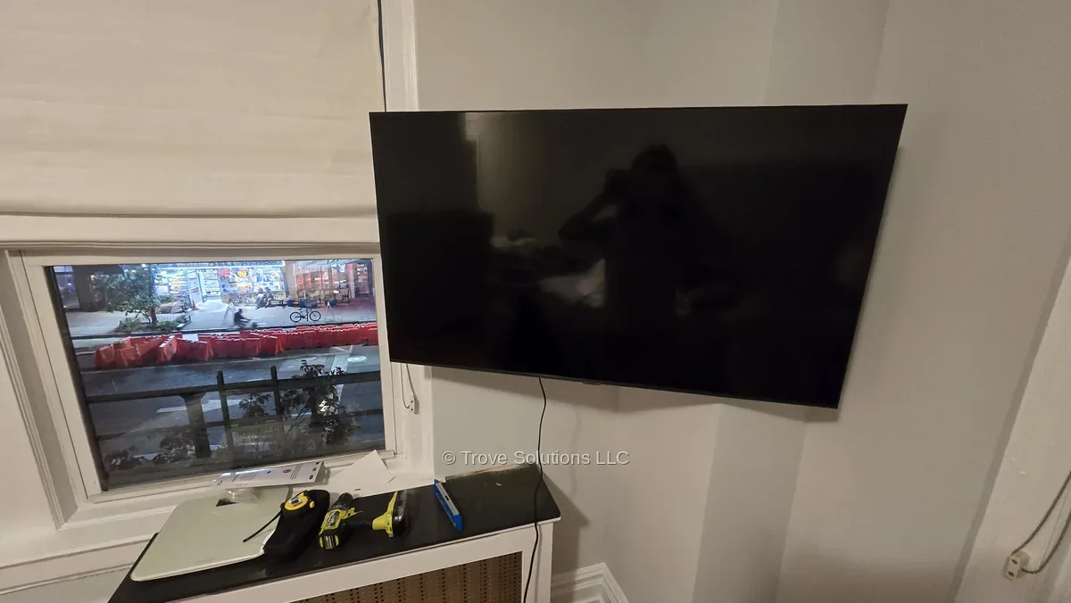 Full motion TV mount angled into room corner Manhattan