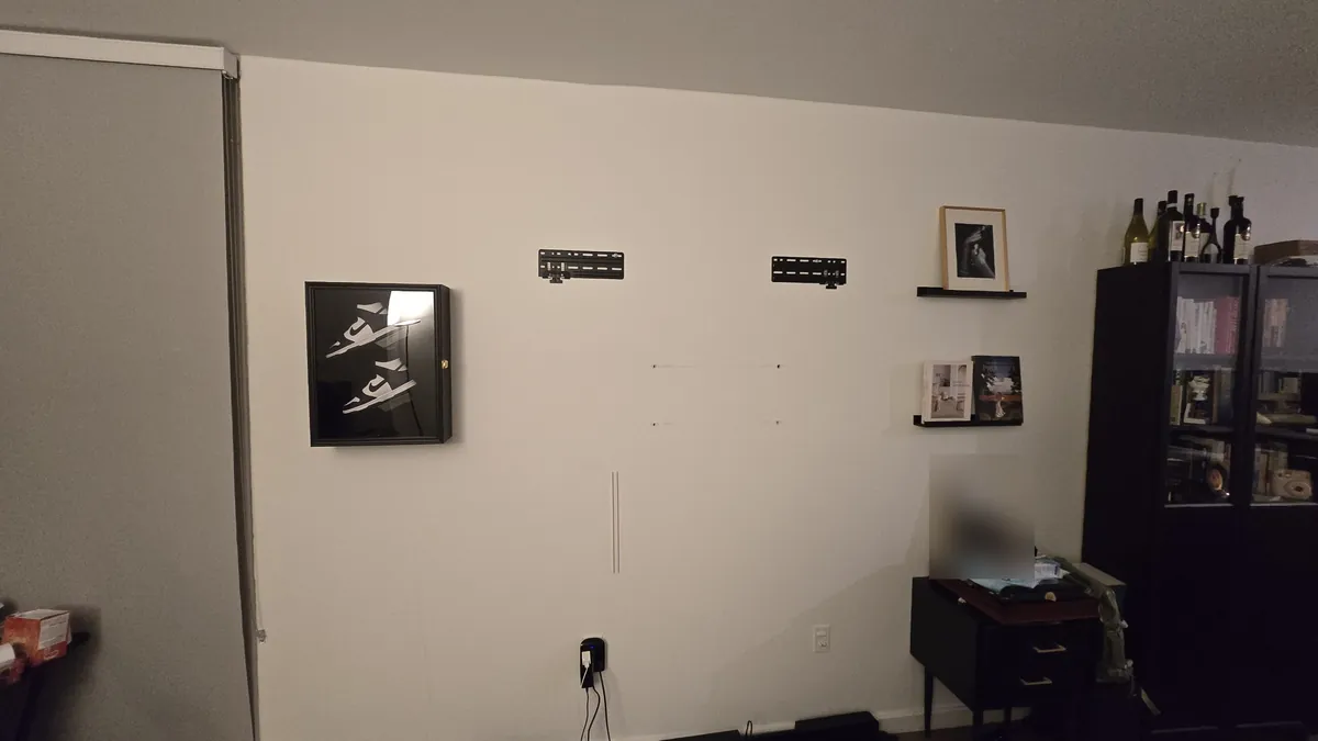 Two Samsung Slim Fit wall plates mounted on a living room wall