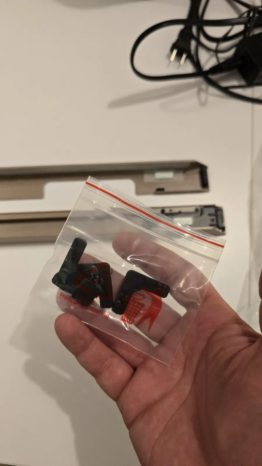 Bag of black plastic corner connectors for the Hisense CanvasTV frame