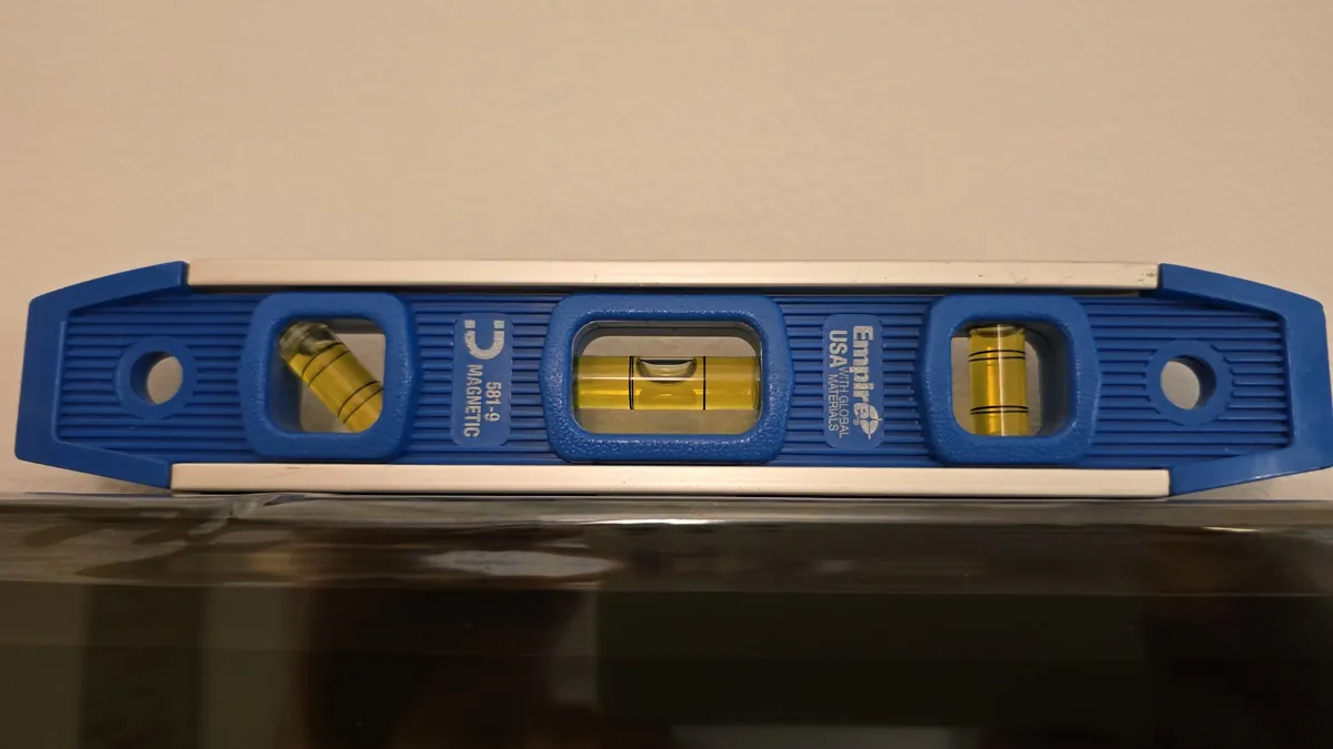 Bubble level on the top edge of the mounted TV