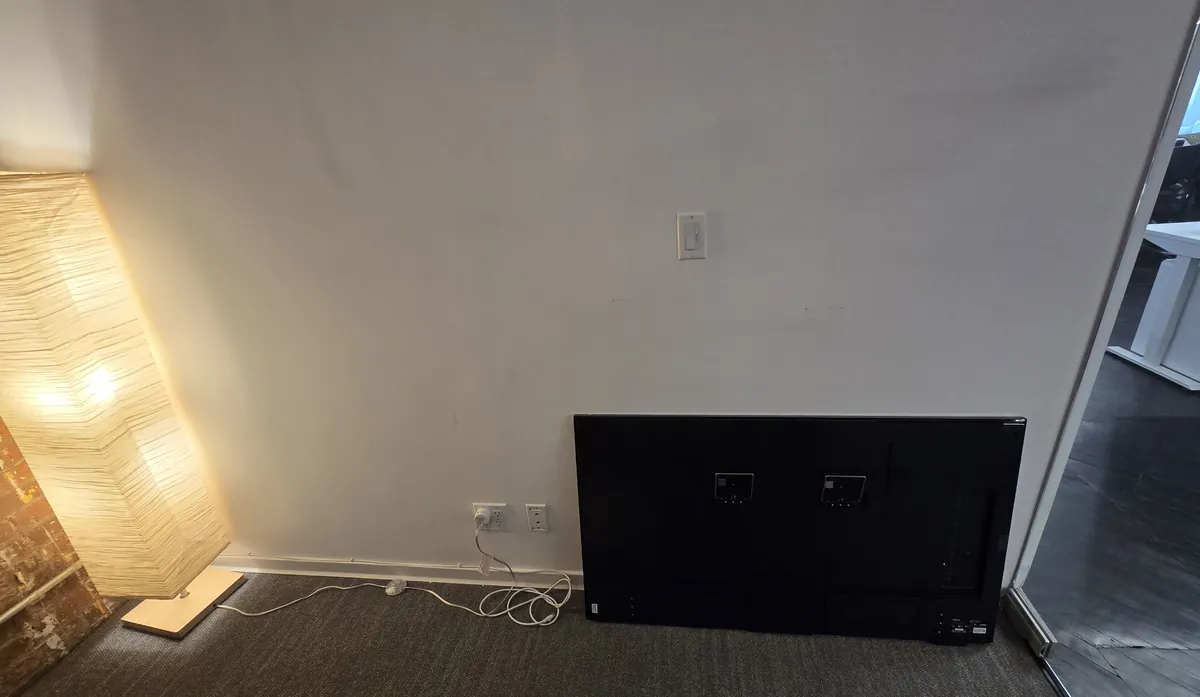 Hisense CanvasTV leaning against the wall with its back panel facing out